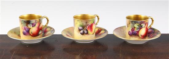 Three Royal Worcester fruit painted coffee cans and saucers, early 20th century, cans 2in.